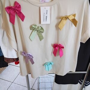 Cream Top with Multicolor Bows